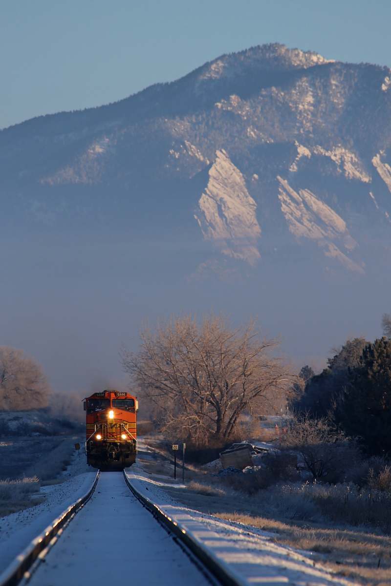 united states train near mountain range boulder